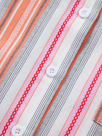 Close-up of a fabric with striped pattern and buttons