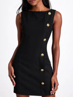Black dress with gold buttons on a white background