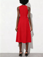 Red dress worn by a person on a white background