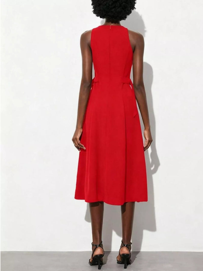 Red dress worn by a person on a white background
