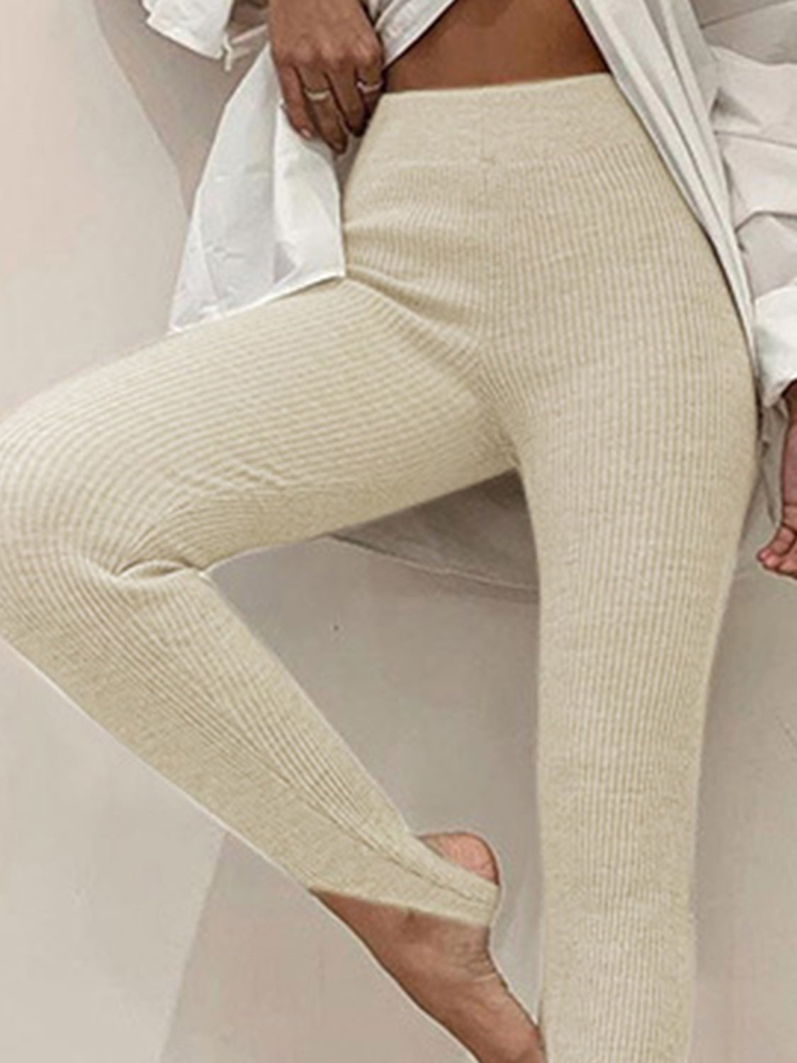 Beige ribbed leggings worn by a person on a neutral background