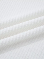 Close-up of white textured fabric