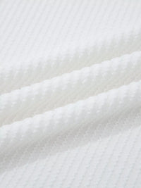 Close-up of white textured fabric