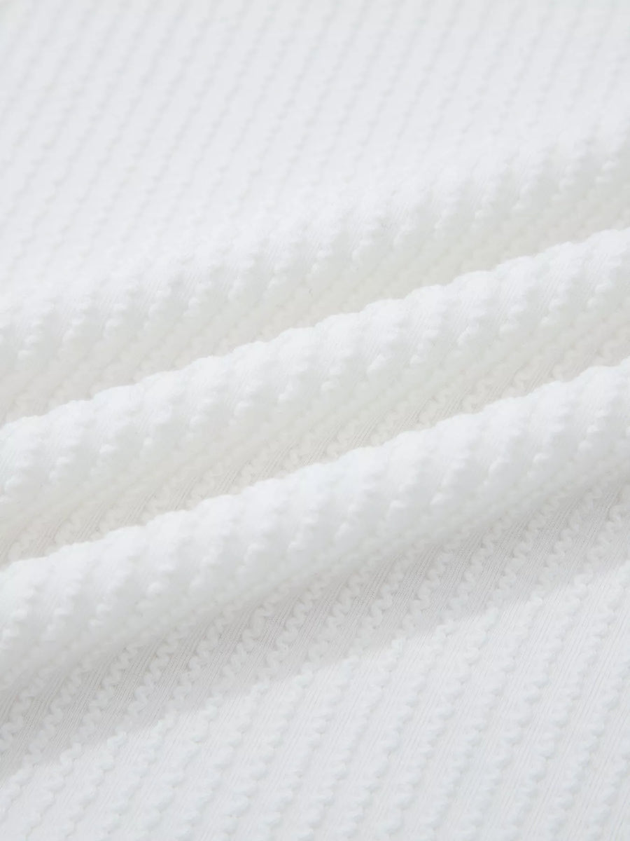 Close-up of white textured fabric