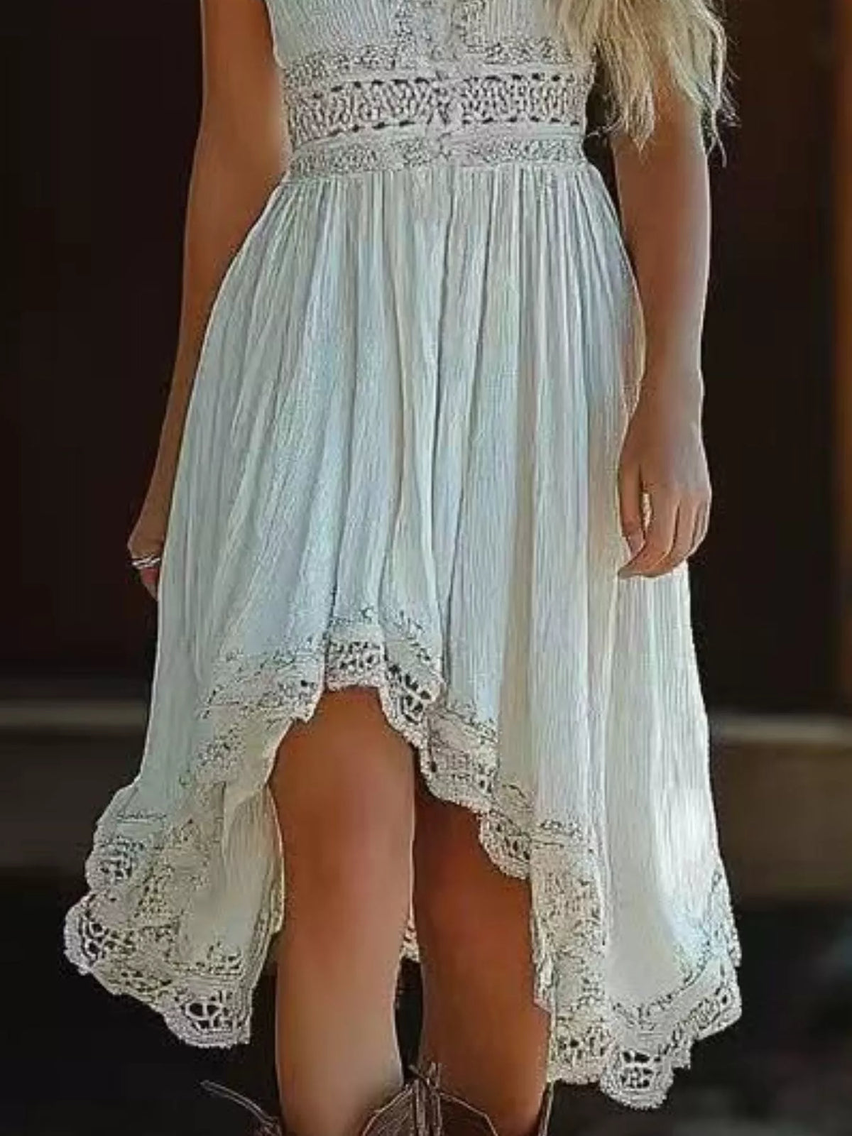Light blue dress with lace details on a blurred background