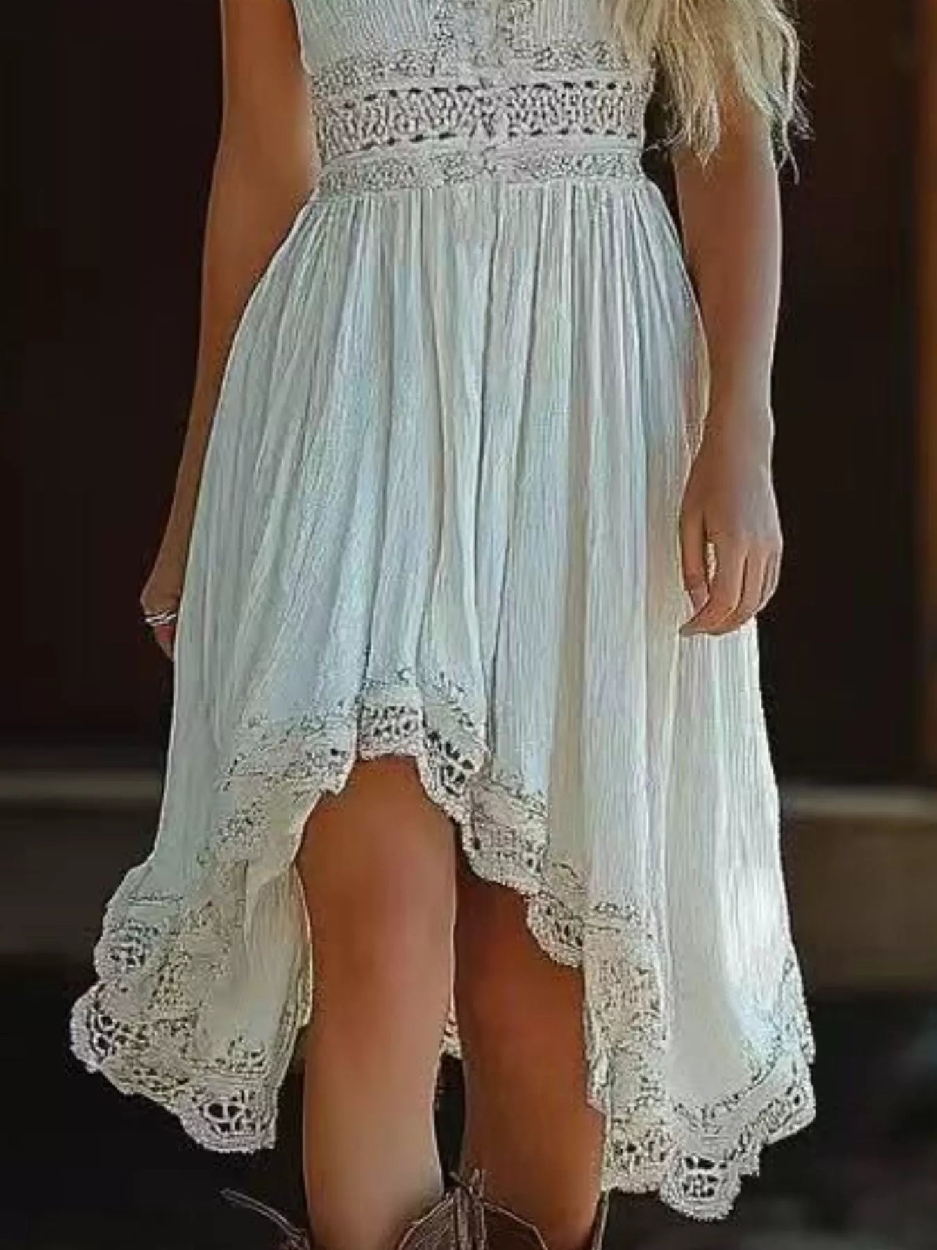 Light blue dress with lace details on a blurred background