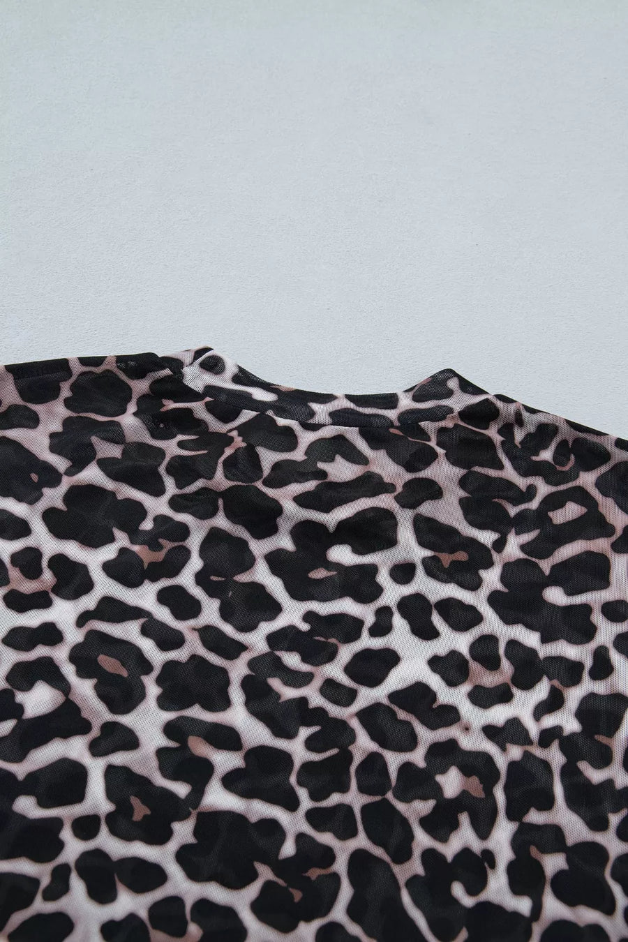 Leopard print fabric on a light gray background