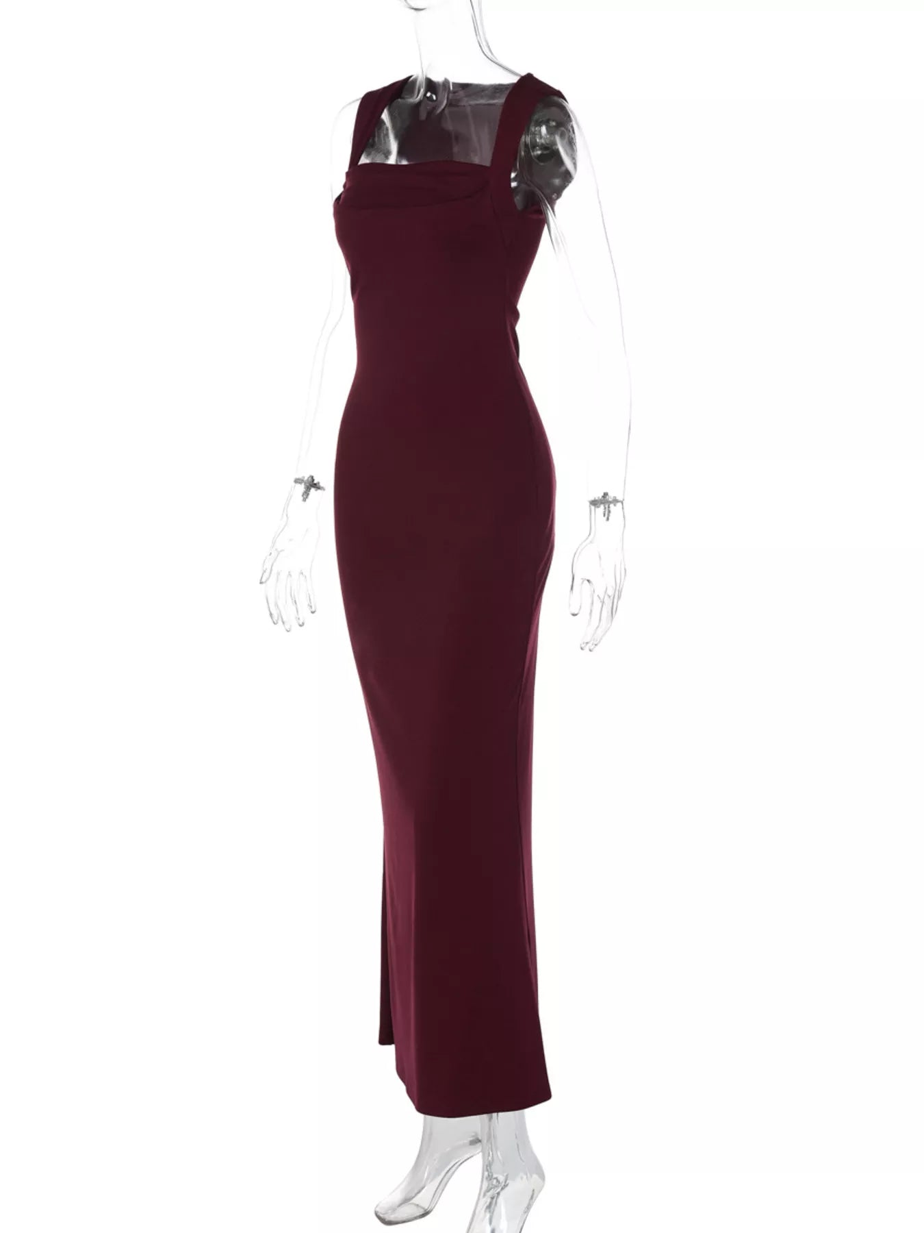 Burgundy evening gown on a mannequin against a white background
