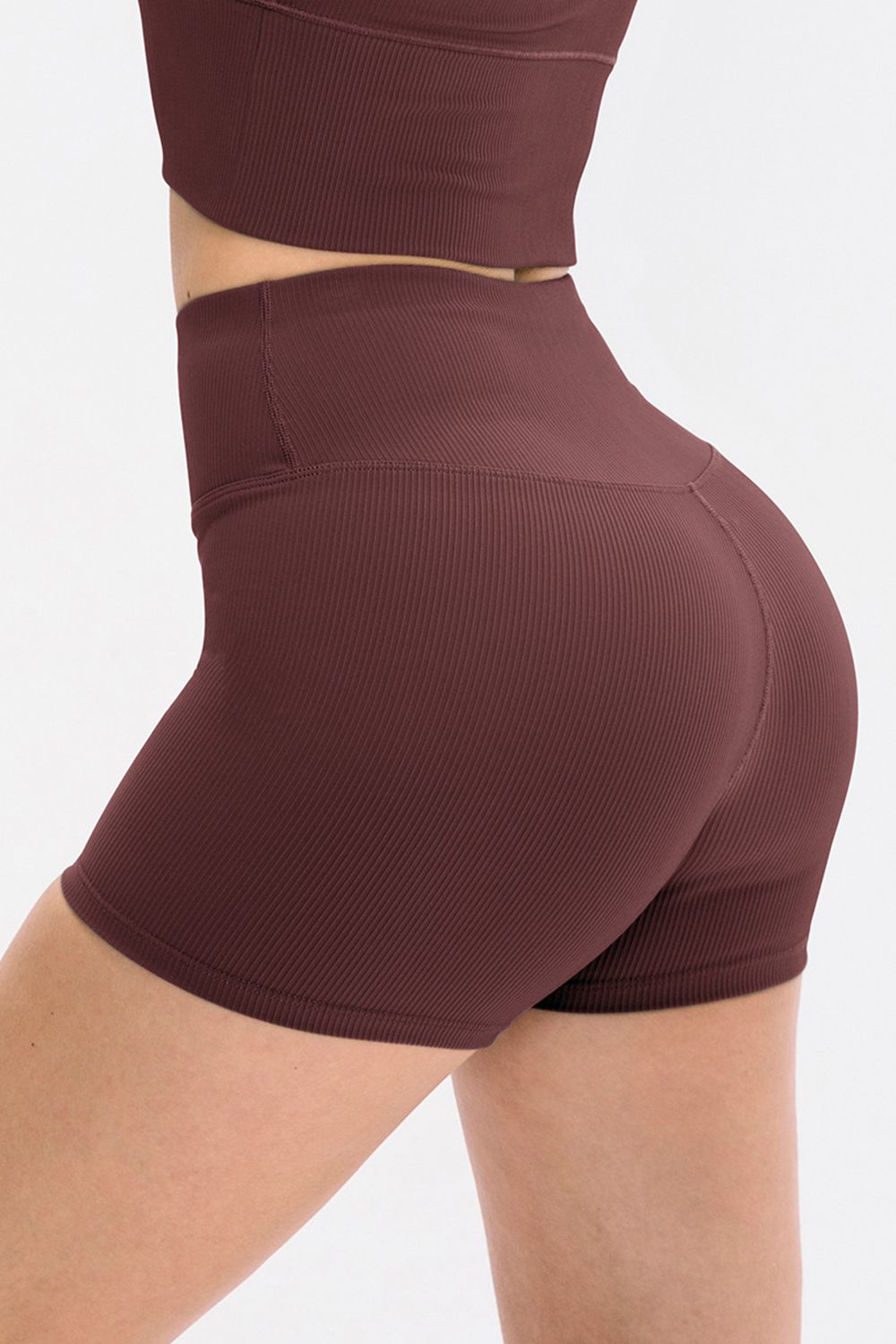 Maroon high-waisted shorts on a plain background