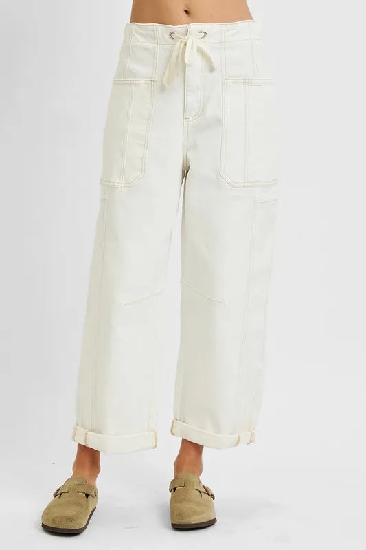 White wide-leg pants worn by a person on a white background