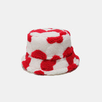 Bucket hat with red and white pattern on a light gray background