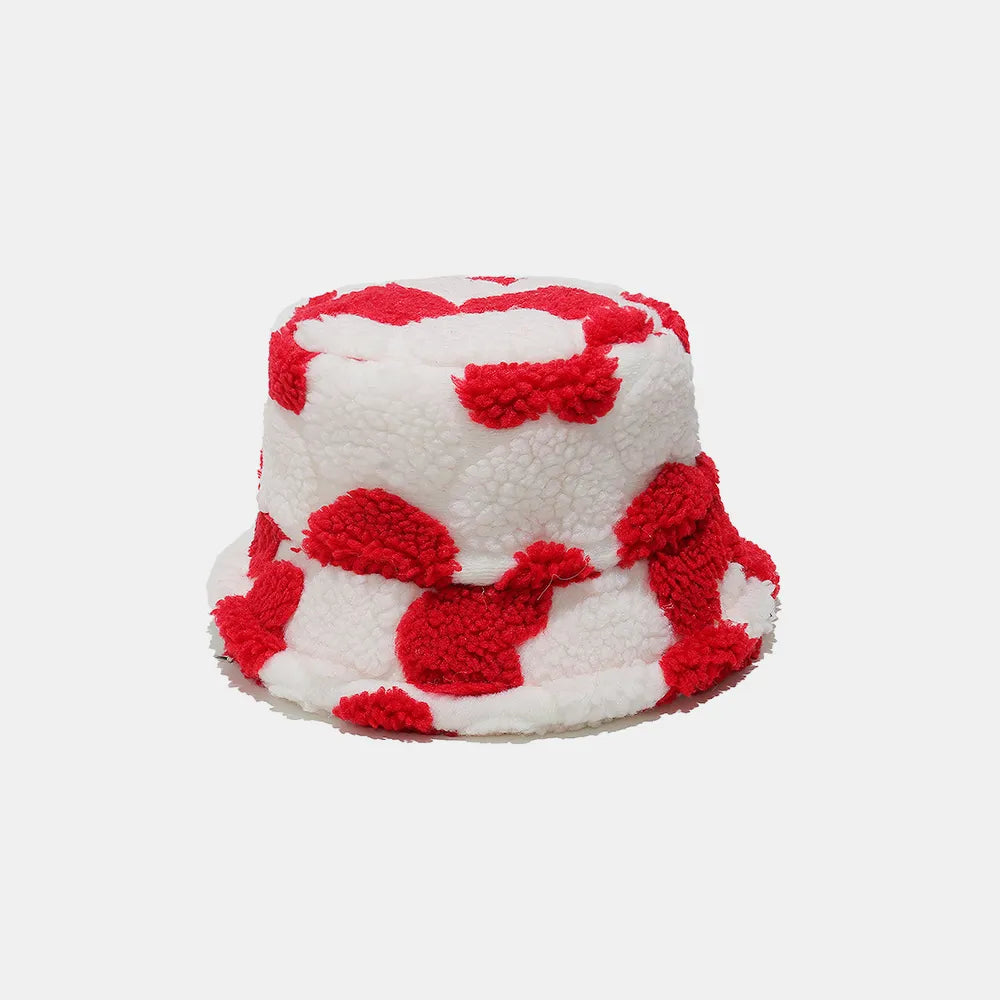 Bucket hat with red and white pattern on a light gray background