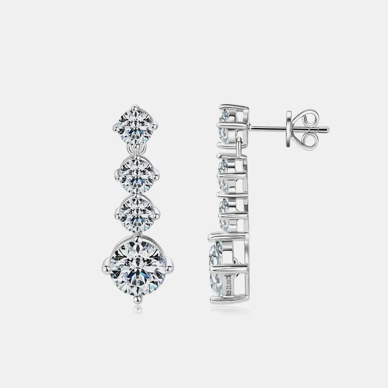 Pair of diamond earrings on a light gray background