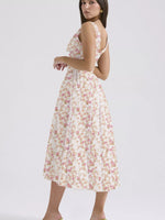 Woman wearing a floral dress on a white background