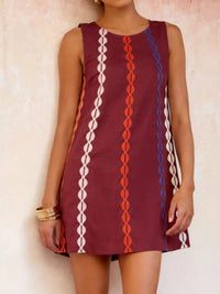 Maroon dress with colorful geometric pattern worn by a person against a light background