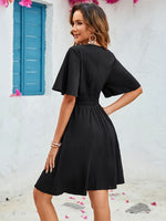 Back view of black Surplice Flutter Sleeve Mini Dress