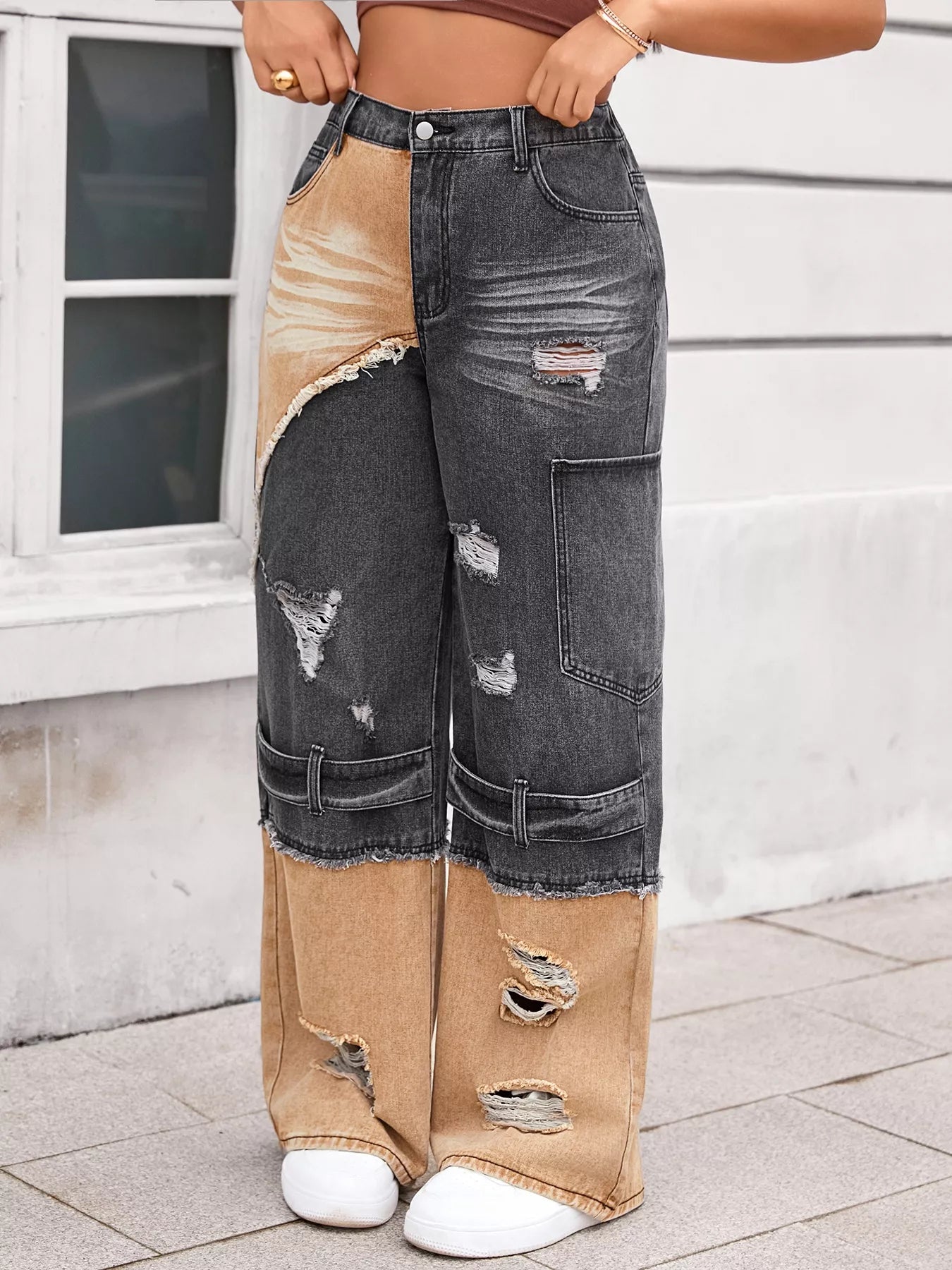 Person wearing a unique denim outfit with patchwork design.