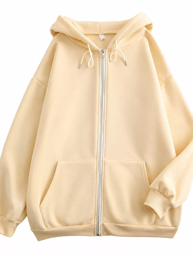 A pale yellow zip-up hoodie with white drawstrings and a white zipper, displayed against a solid white background.