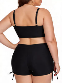 Person wearing a black bikini set on a white background