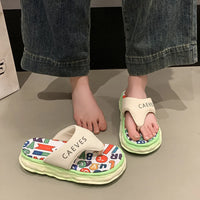 Children's sandals with colorful sole design and 'CAEVES' branding on a neutral background.