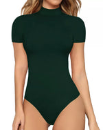Green bodysuit worn by a model on a white background