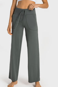 Gray wide-leg pants with a drawstring waist on a white background