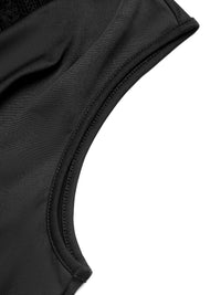 Close-up of a black swimsuit top on a white background