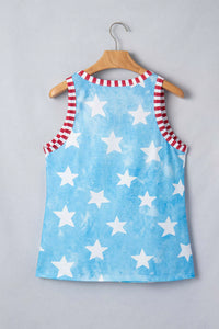 Children's dress with star pattern on a hanger against a gray background