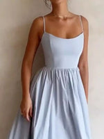 Light blue dress worn by a person against a neutral background