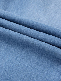 Close-up of blue fabric with a subtle texture
