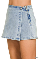 Light blue denim skirt on a white background