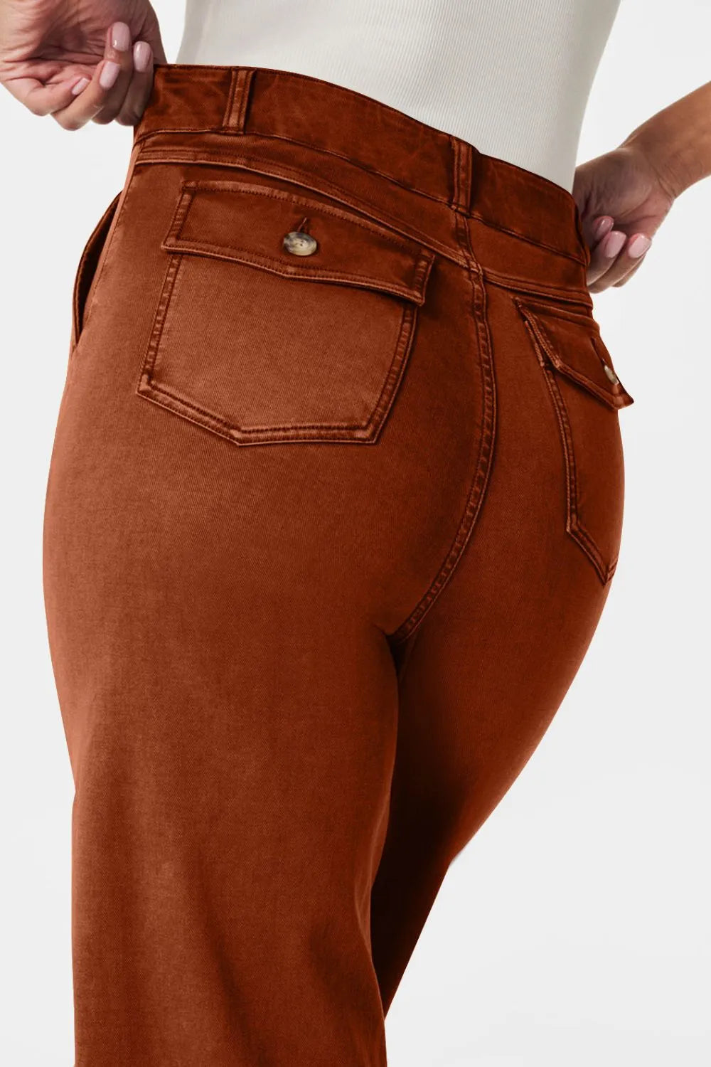 Brown pants with a pocket detail on a white background