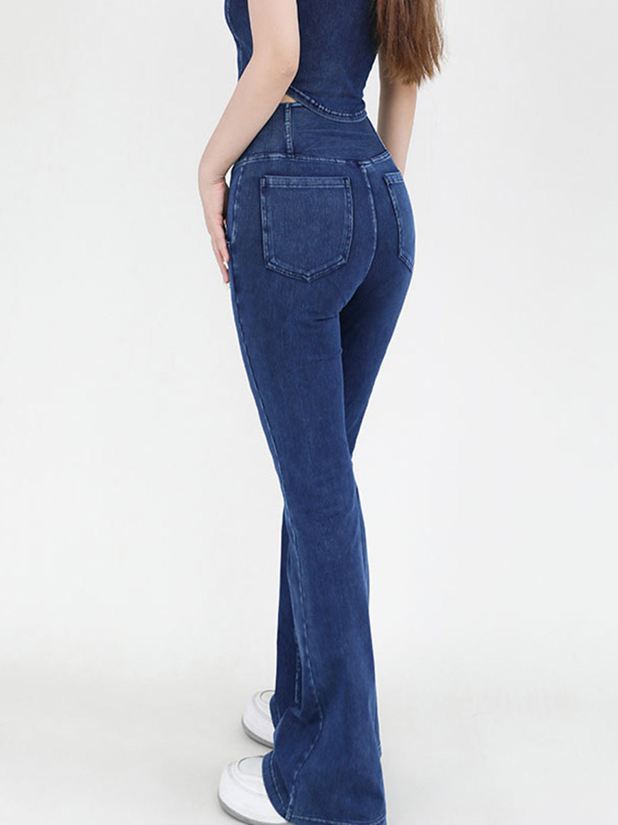 Person wearing blue jeans on a white background