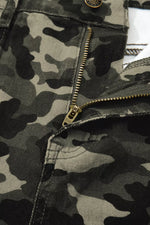 Close-up of a camouflage jacket with a zipper