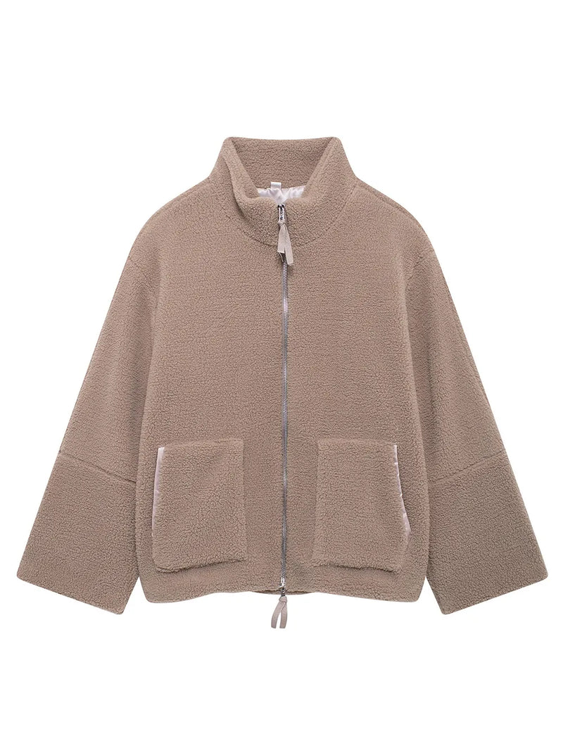 Beige fleece jacket with zippers on a white background