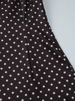 Close-up of brown fabric with white polka dots on a white background