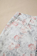 Floral patterned shorts on a beige background