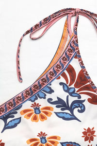 Triangular bikini top with colorful floral pattern on a white background