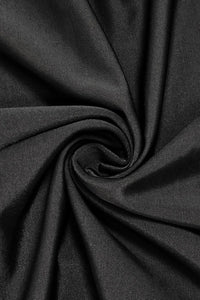 Close-up of dark gray fabric with folds