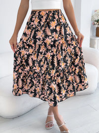Person wearing a floral skirt with a white background