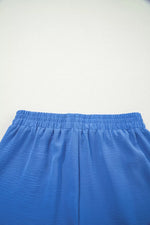 Blue shorts on a light gray background