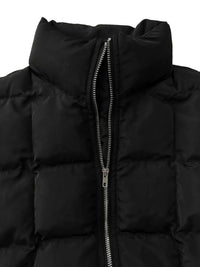 Close-up of a black puffer jacket with a zipper on a white background