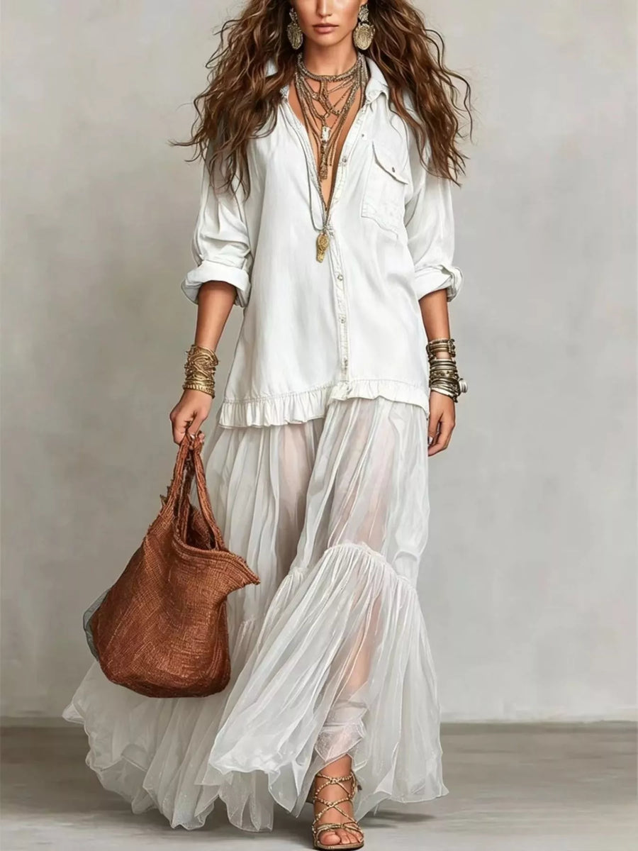 Woman in a white outfit holding a brown bag against a plain background