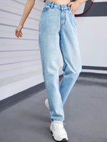 Light blue jeans worn by a person on a plain background