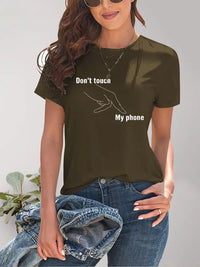Person wearing a brown t-shirt with 'Don't touch my phone' text and graphic.