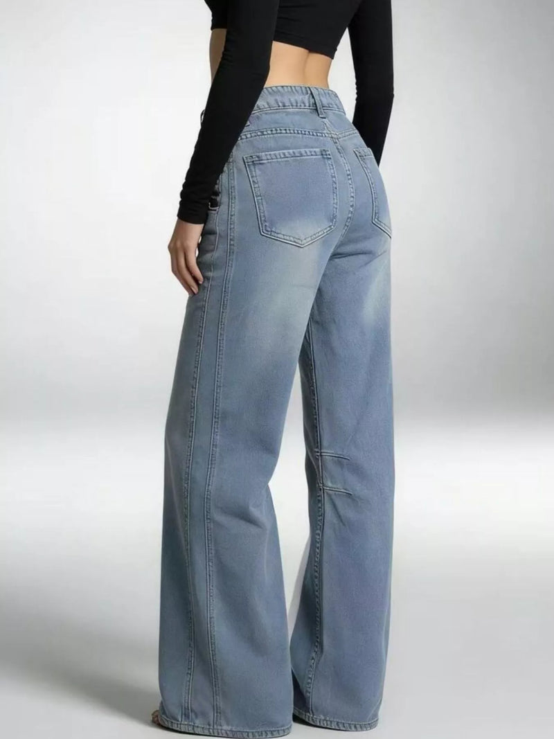 Light blue jeans worn by a person on a white background
