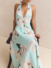 Woman wearing a floral dress with a light blue background