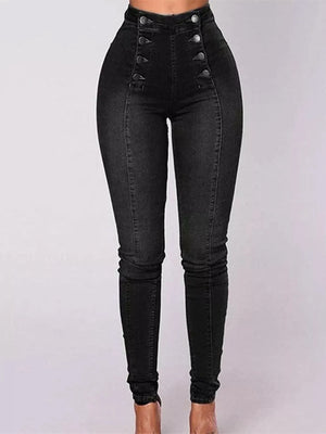 Black jeans with button details on a white background