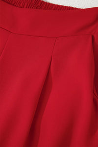 Close-up of a red garment with a textured edge.