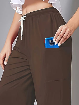 Brown pants with a pocket holding a blue phone on a gray background